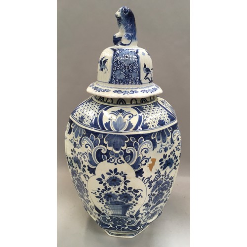 271 - Large blue and white oriental ginger jar with lion finial to the top 53cm tall.