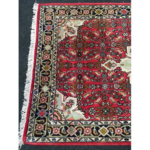 319 - Red Iranian rug in a red set pattern 130x70cm