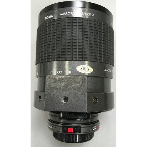 221 - Sigma Macro 1:3 mirror telephoto lens with filters and carry case