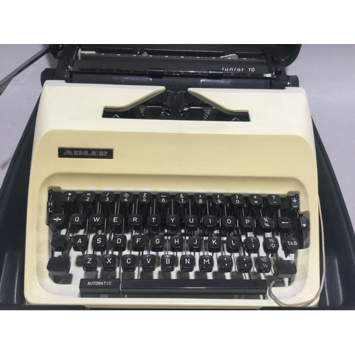 253 - Vintage Adler Junior 10 type writer in carry case with  instructions