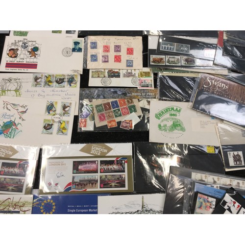 212 - Large Quantity of first day covers, presentation packs, booklets, decimal mint stamps etc