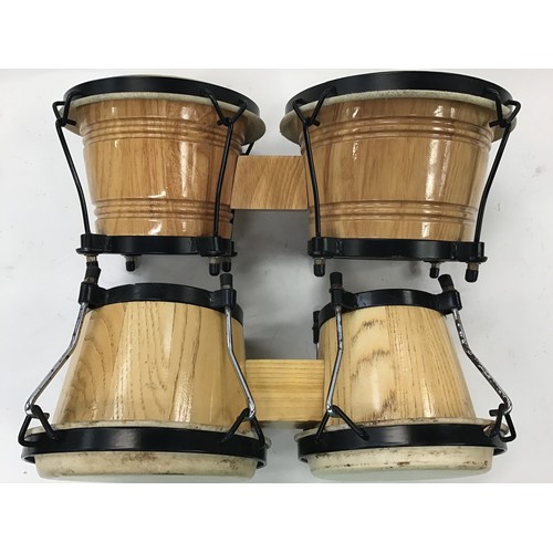 329 - Two sets of bongo drums.