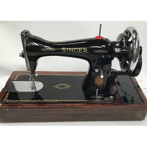 261 - Two vintage Singer sewing machines together with a vintage boxed G&C iron.