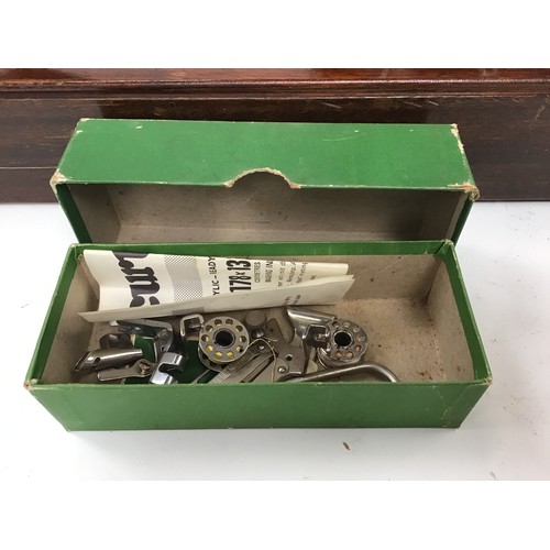 261 - Two vintage Singer sewing machines together with a vintage boxed G&C iron.