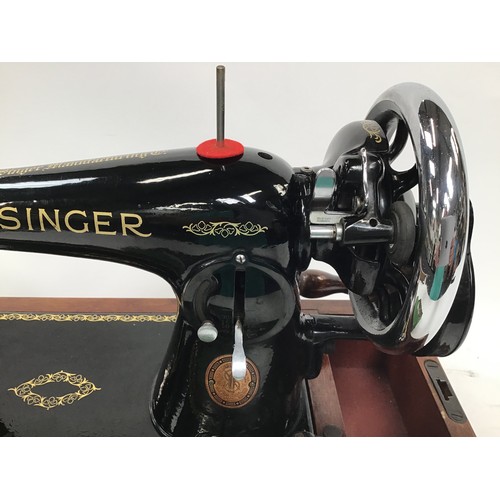 261 - Two vintage Singer sewing machines together with a vintage boxed G&C iron.