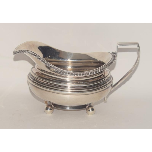 352 - A solid silver Georgian milk jug assayed in Newcastle, 1794, by John Robertson II and John Walton.