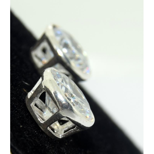 290 - A pair of substantial silver and CZ stud earrings 5cts +