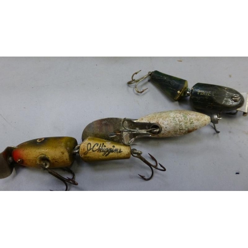 Selection of vintage fishing rods and lures including Trevor