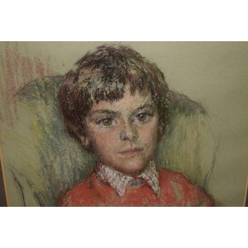 188 - Framed and glazed portrait of a young boy in pastels. Signed Ronald Dickinson (?) 1971. Overall fram... 