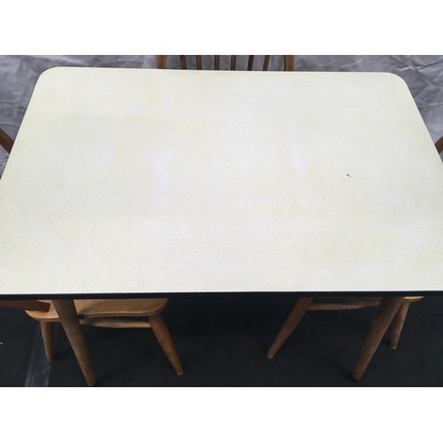 215 - Vintage 1960's formica topped kitchen table. 91cm wide x 60cm deep x 78cm tall together with three s... 