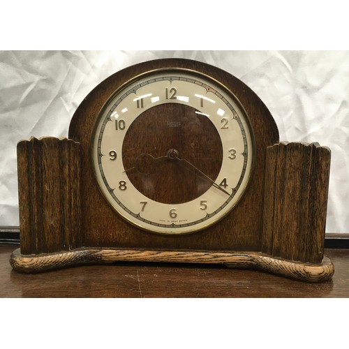 216 - Mahogany butler's trolley on castors 63x45x73cm together with two vintage clocks.