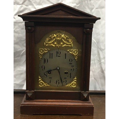 216 - Mahogany butler's trolley on castors 63x45x73cm together with two vintage clocks.