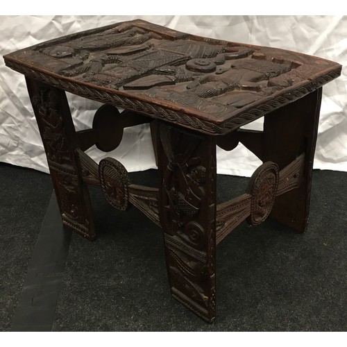 226 - A dark wood possibly Indonesian carved occasional table 51x36x39cm.