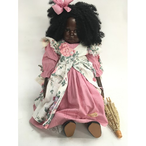 322 - Rita Giles black china doll designer d/jointed.  Marked: 