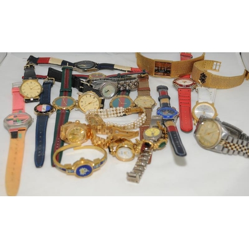20 - A quantity of ladies and gents fashion watches