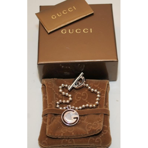 39 - Genuine Gucci Sterling Silver ball chain bracelet with hanging 'G' bead. Comes complete with certifi... 