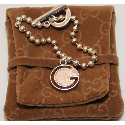 39 - Genuine Gucci Sterling Silver ball chain bracelet with hanging 'G' bead. Comes complete with certifi... 