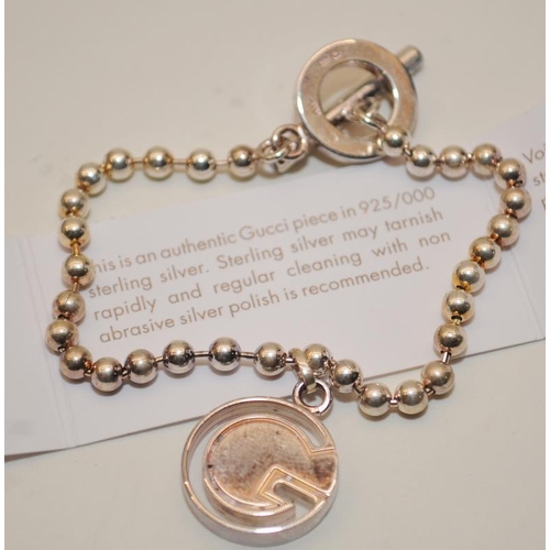 39 - Genuine Gucci Sterling Silver ball chain bracelet with hanging 'G' bead. Comes complete with certifi... 