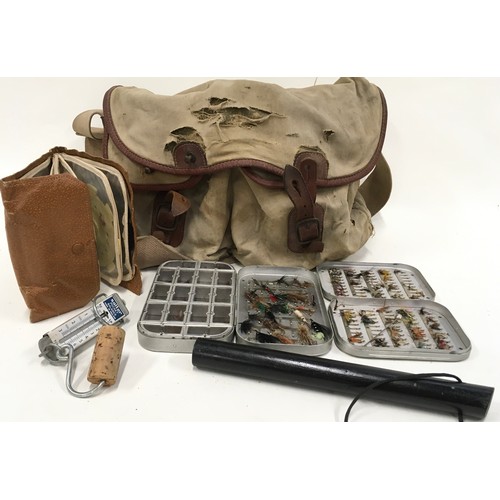2 - Vintage canvas fishing bag containing a good quantity of flies along with vintage scales and a pries... 