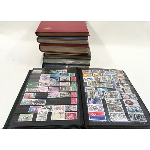 45 - 6 stockbooks of world stamps plus one empty stockbook, 7 in all.