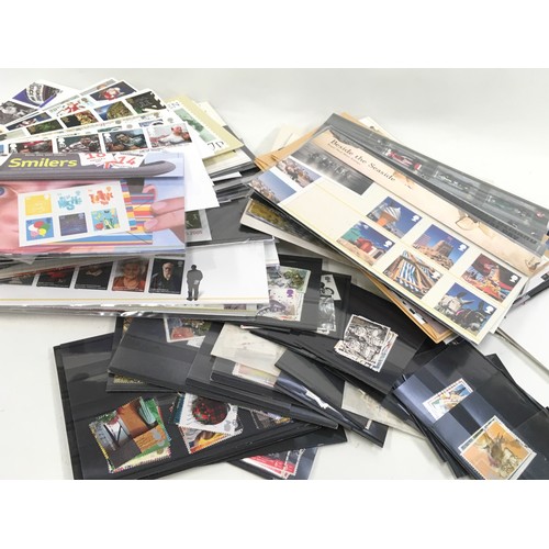 56 - large collection of first day covers, presentation packs and loose stamps in a biscuit box. Many use... 