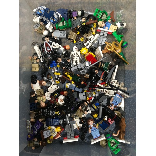 196 - Approx 75 Lego minifigures to include Wizard of Oz, Marvel Loki, Turtles, Indiana Jones and others.