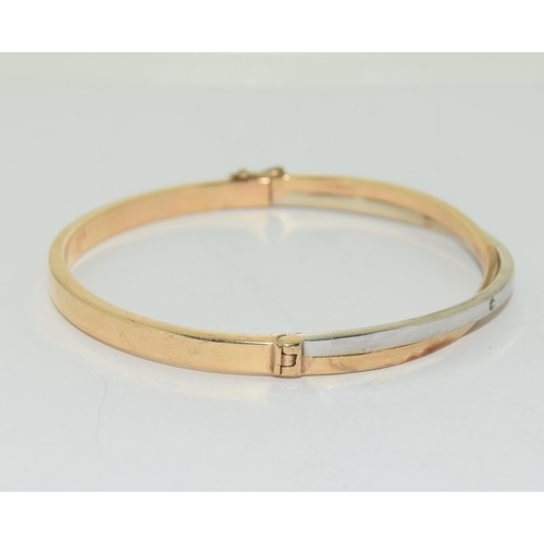 509 - 9ct twin colour ladies diamond set bangle