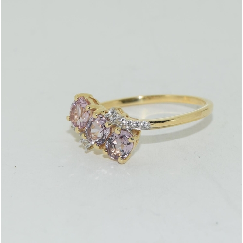 547 - 9ct gold Pink Sapphire twist ring size Q