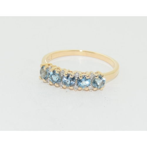 527 - 9ct gold Diamond and Aquamarine 5 stone ring size P