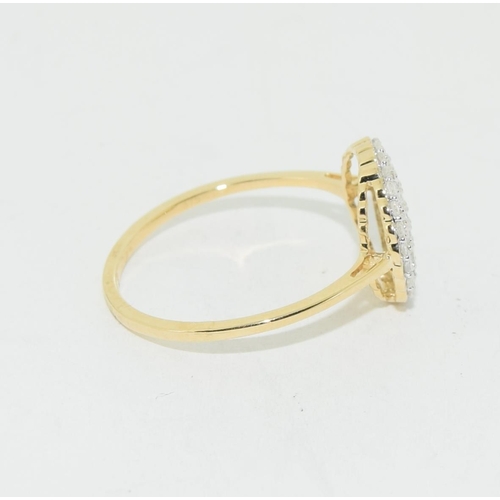 487 - 9ct gold ladies Diamond target style ring size Q