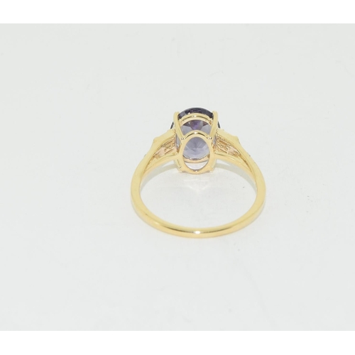 517 - 9ct gold natural Blue garnet and diamond ring size N