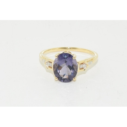 517 - 9ct gold natural Blue garnet and diamond ring size N