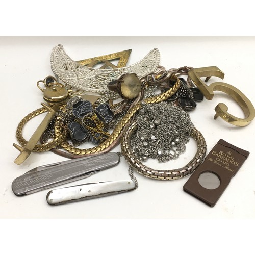 458 - Small collection of costume jewellery to include a vintage cigar cutter