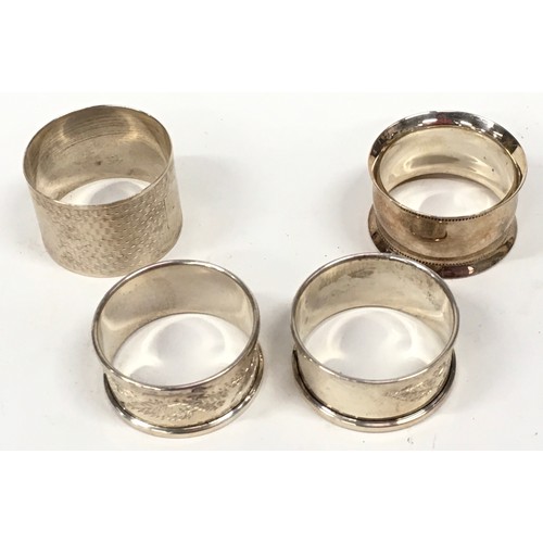 403 - Silver hallmarked sugar togs together with a silver hallmarked ladle and napkin rings.