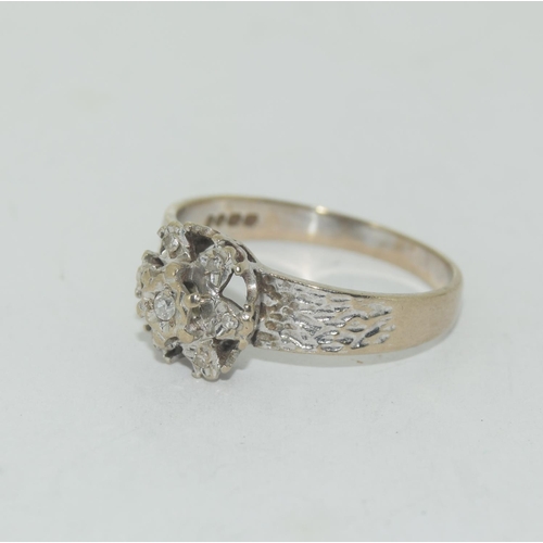 455 - A Vintage 18ct white gold and diamond cluster ring.