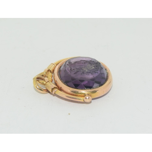 572 - An antique 19th century natural amethyst and gold intaglio seal.