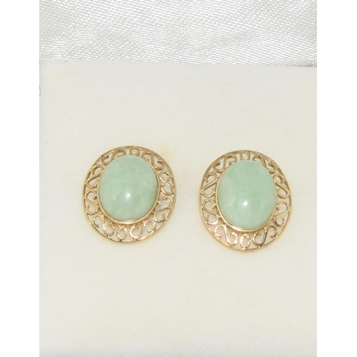 595 - A pair of large natural Jade & 9ct gold earrings.