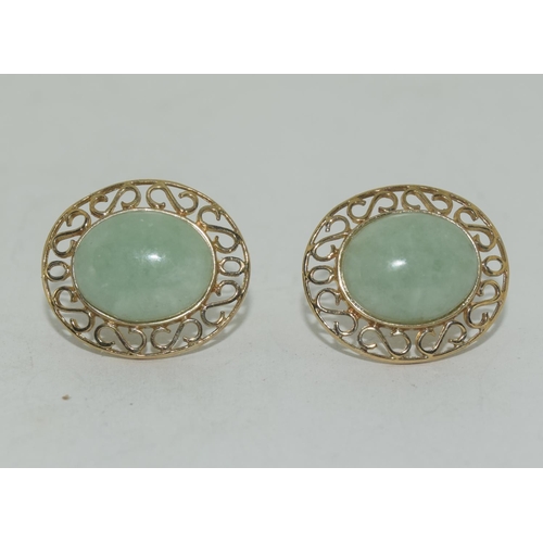 595 - A pair of large natural Jade & 9ct gold earrings.