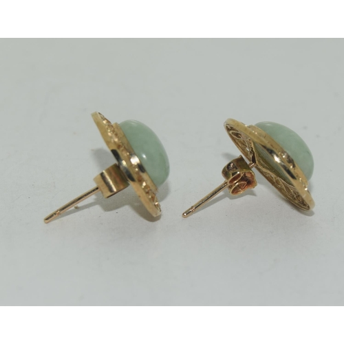 595 - A pair of large natural Jade & 9ct gold earrings.