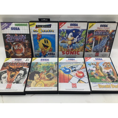 517 - SEGA MASTER SYSTEM 2 AND GAMES. 8 games come in this lot to include - PAC-Mania - Sonic The Hedgehog... 