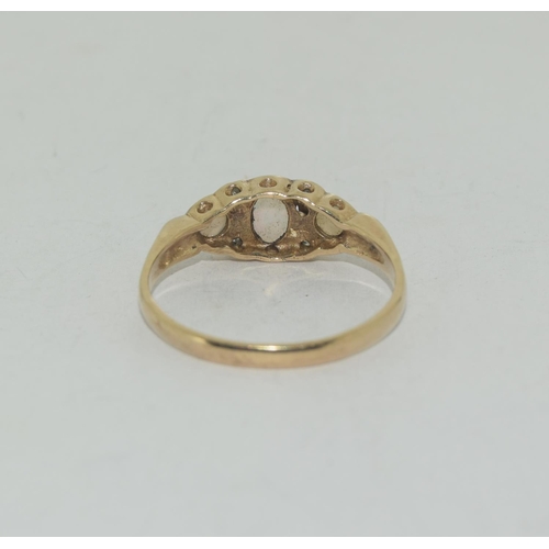 560 - 9ct gold Opal and diamond ring size O