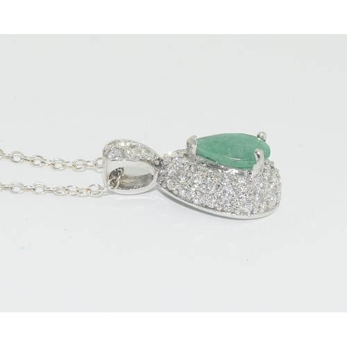 586 - 14ct white gold pear shape emerald and diamond pendant necklace of over 2cts