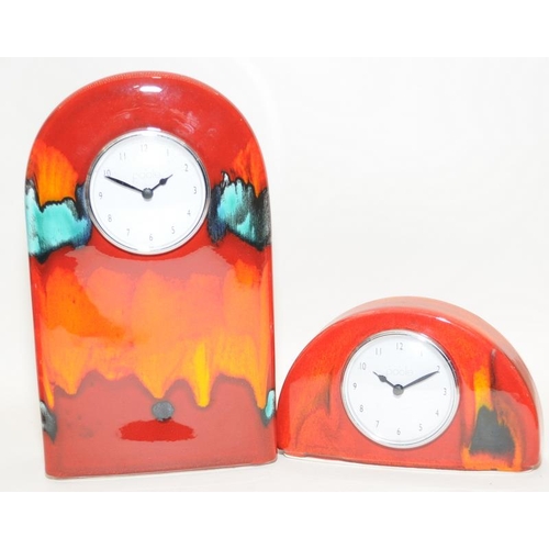 245 - Poole Pottery Volcano to include two clocks, small concave bowl & four vases, together with a small ... 