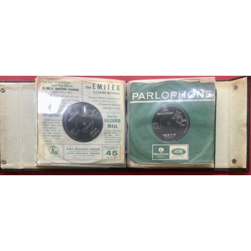 279 - BLACK RECORD FOLDER. A great folder in Ex condition here housing 20 various Beatle singles on the Pa... 