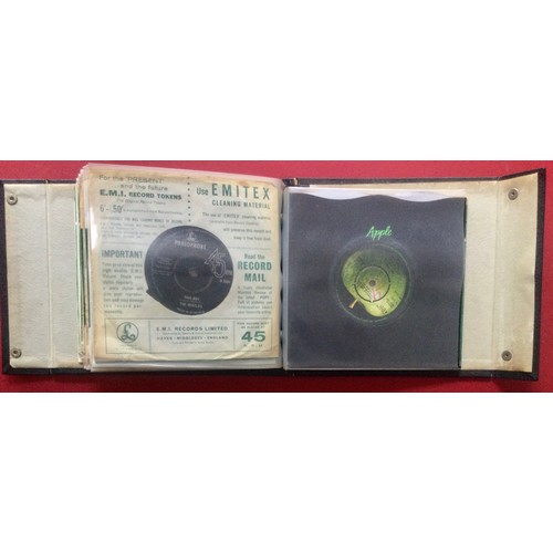 279 - BLACK RECORD FOLDER. A great folder in Ex condition here housing 20 various Beatle singles on the Pa... 