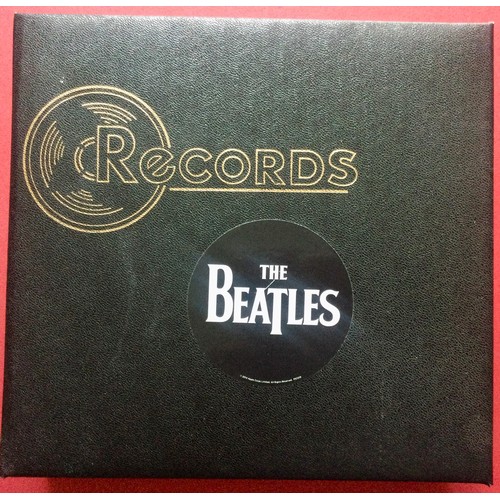 279 - BLACK RECORD FOLDER. A great folder in Ex condition here housing 20 various Beatle singles on the Pa... 