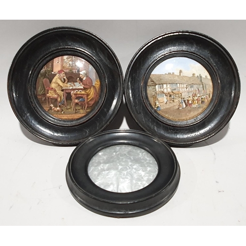 176 - A pair of Victorian ceramic pot lids in oak frames together with another fabric pot lid.