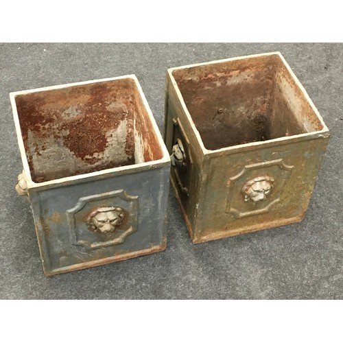 287 - A pair of antique cast metal planters with lion head finials each measuring 28x28x30cm.