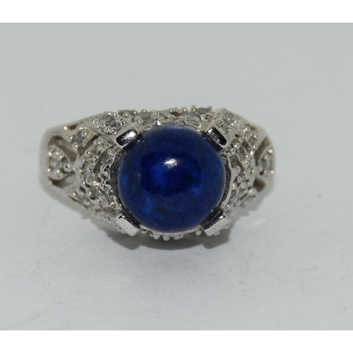 415 - 9ct white gold ladies diamond side, unpolished sapphire center stone ring size O