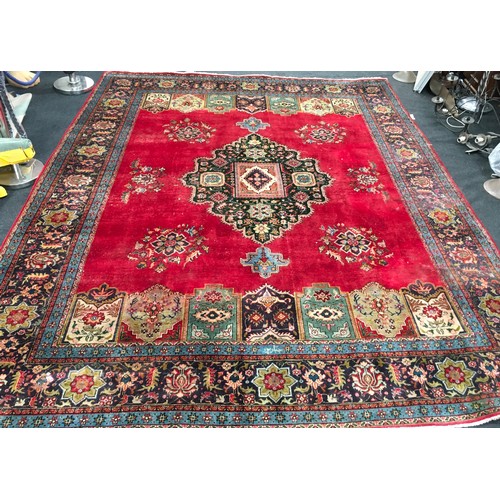 472 - Large room size vintage Hamadan carpet. Multicoloured on a red ground. O/all size 3.8m x 3.0m